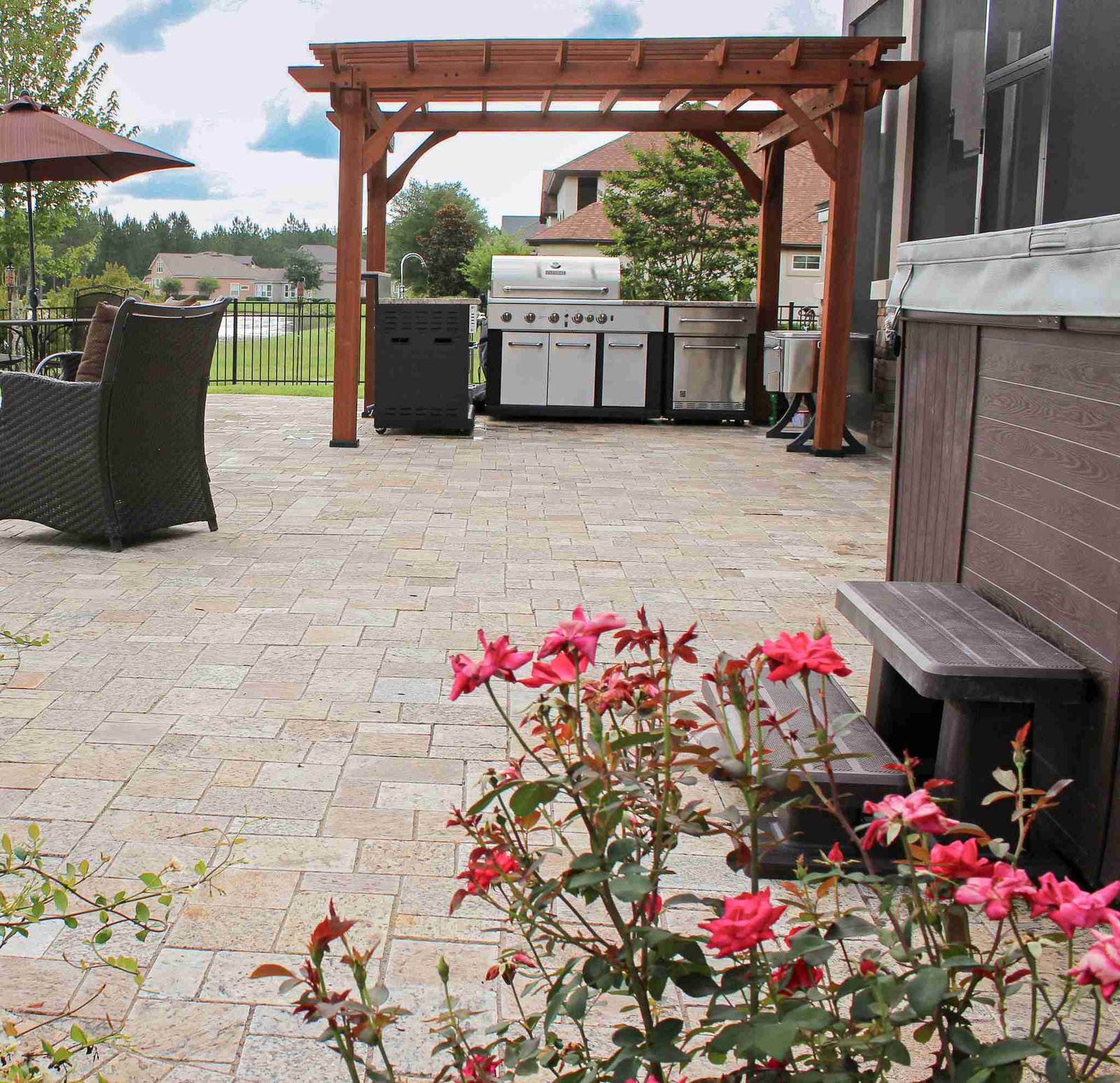 Paver patio with cedar pergola and outdoor grill station
